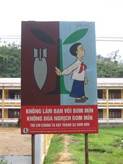 Sign Warning Children to Stay Away from Unexploded Ordnance in Rural Vietnam