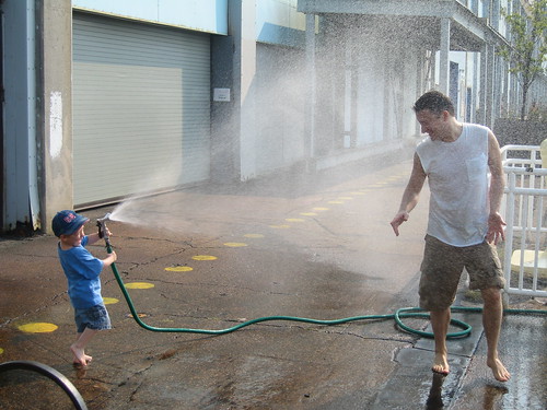 Apparently, city kids rarely get to play with hoses