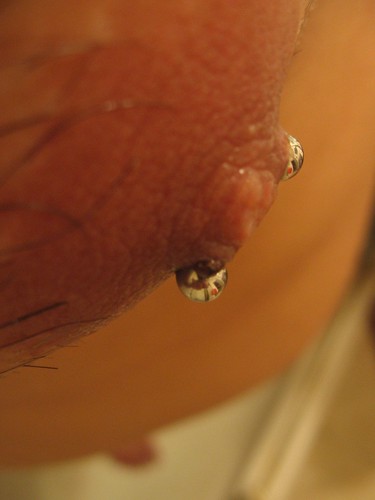 Nipple piercing close-up of left 