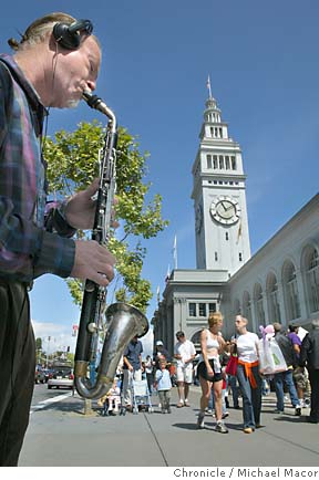A clarinet player entertains passersby at San Francisco's restored Ferry Building