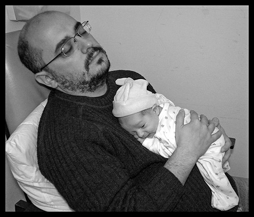 Dad sleeping with Baby