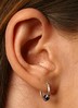 woman with pierced earlobe