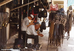 A leather salesman getting a neckrub