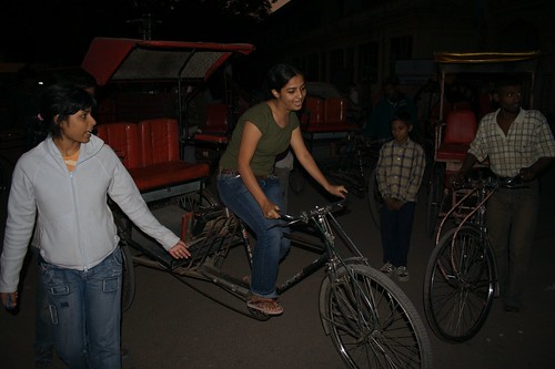 Manasi riding a cycle-rickshaw