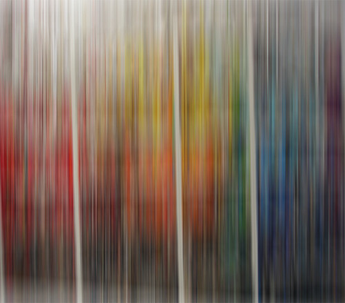 Books by colour, blurred