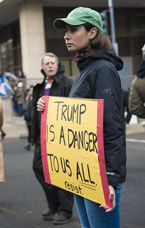 A Protester Holds a Sign Outside the Presidential Inauguration of Donald Trump
