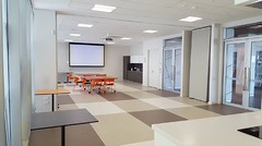 Community rooms - meeting setup - tables and chairs and screen