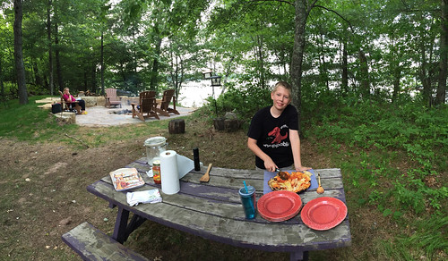 Kai cuts the dutch oven pizza. • <a style="font-size:0.8em;" href="http://www.flickr.com/photos/96277117@N00/19515606742/" target="_blank">View on Flickr</a>