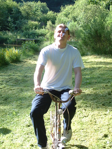 Luc smoking on a bicycle
