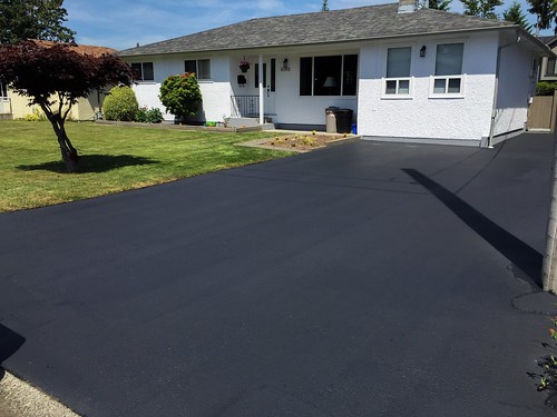 Residential driveway sealing.  Double coat for extra life.