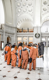 Witness Against Torture Demonstrators Huddle in the Lobby at Union Station to Discuss Their Next Action