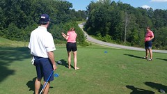 Emily takes a swing at the Humane Society fundraiser