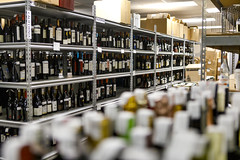 0313 Wine bottles on shelves at TEXSOM