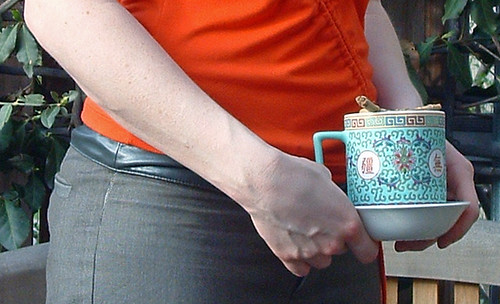 goddess daughter's hands, holding a chinese tea mug