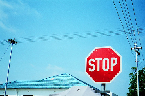Stop sign with a building in the background