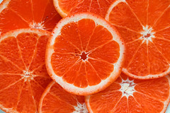 Closeup of sliced juicy blood oranges textured background
