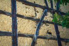 Wattle and daub is a composite building method used for making walls and buildings, in which a woven lattice of wooden strips called wattle is daubed with a sticky material usually made of some combination of wet soil, clay, sand, animal dung and straw. W