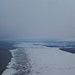 Cool blue and white icy flows of Cook Inlet's gray flats, winter, Anchorage, Alaska, USA
