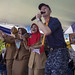 Sailor sings during a community relations.
